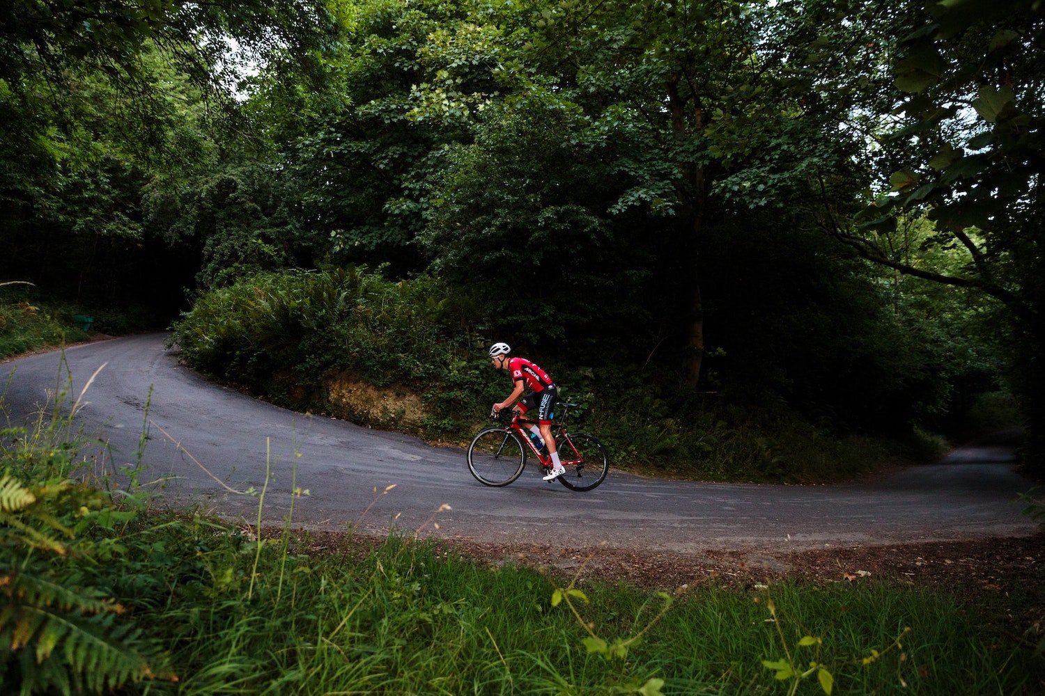 Cyclist climbing hill