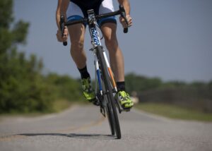 Person cycling on a road