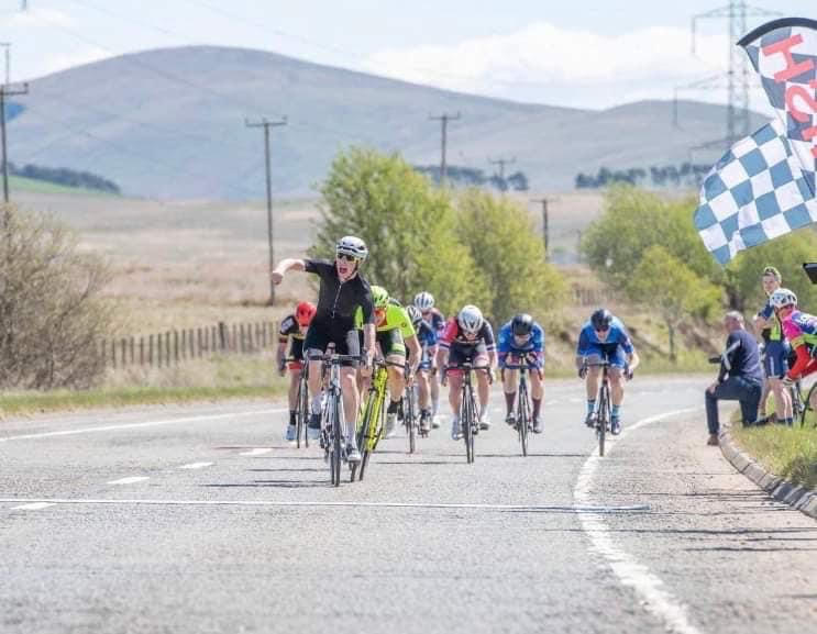 Alexander Macrae winning a bike race