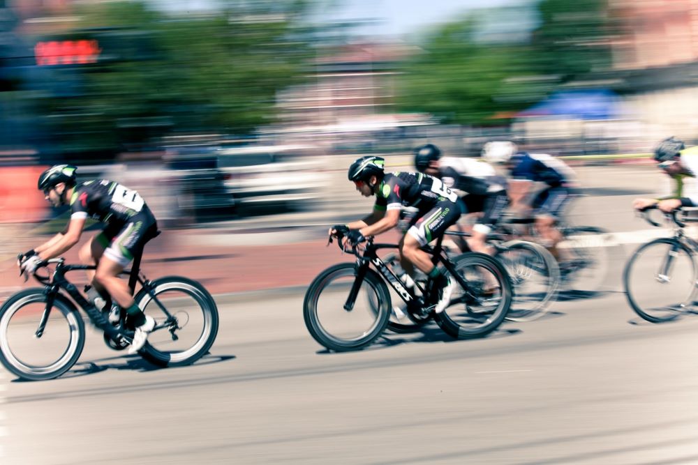 men racing bicycles