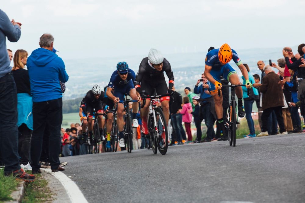 Bicycle racers cresting a hill